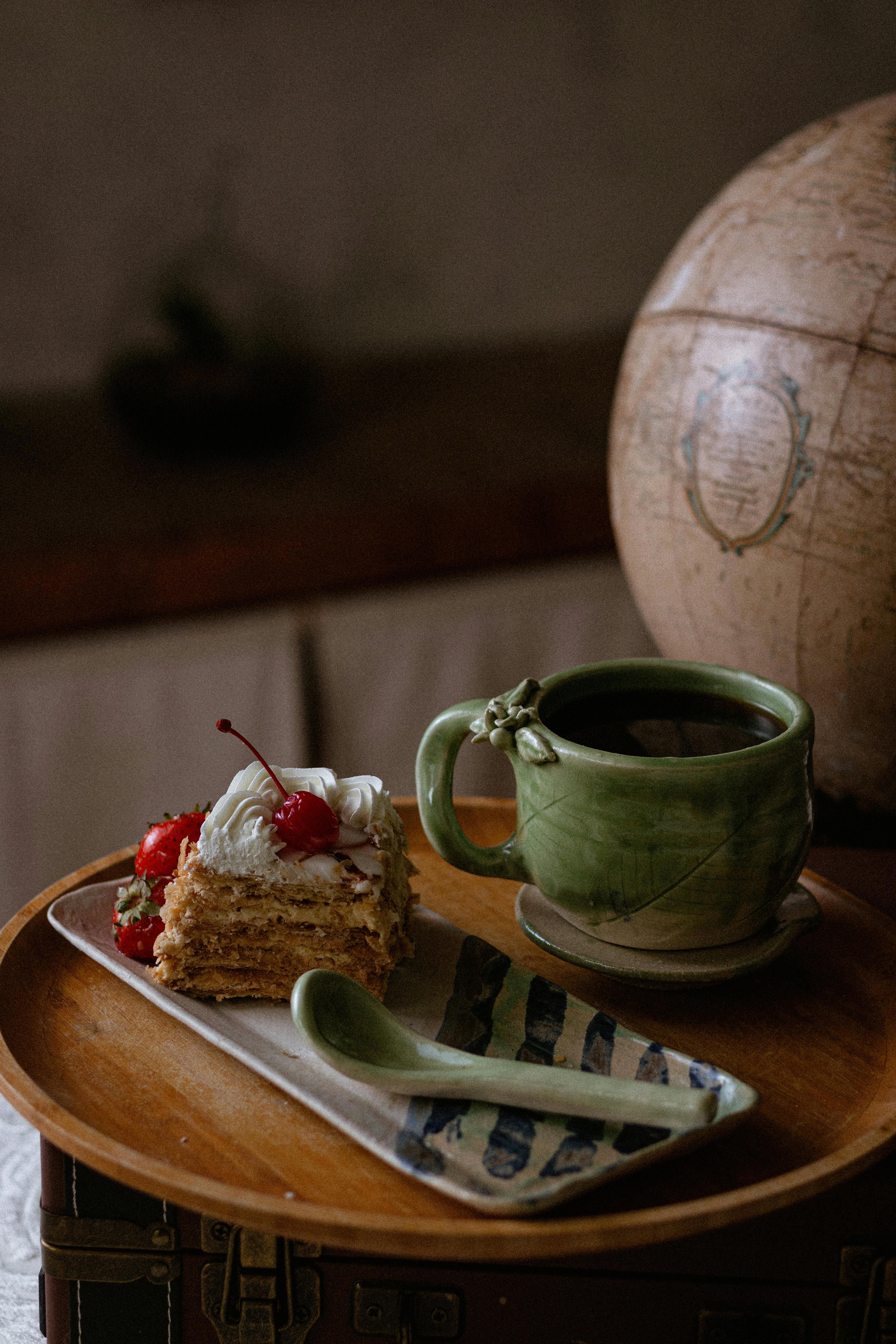 Mexican artisan ceramic mug and cake on wooden tray, evoking a rustic feel.