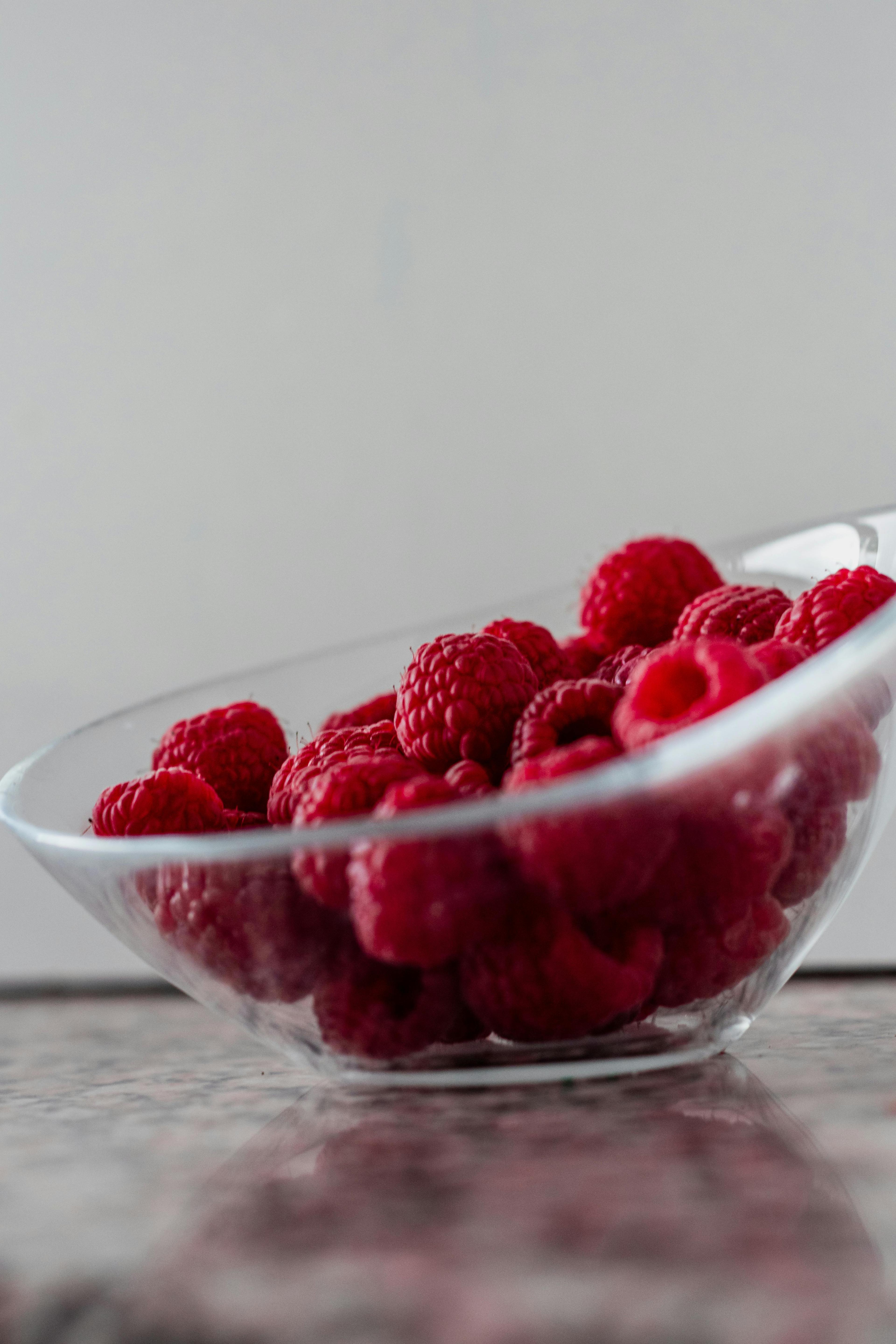 Raspberries in a Clear Glass Bowl