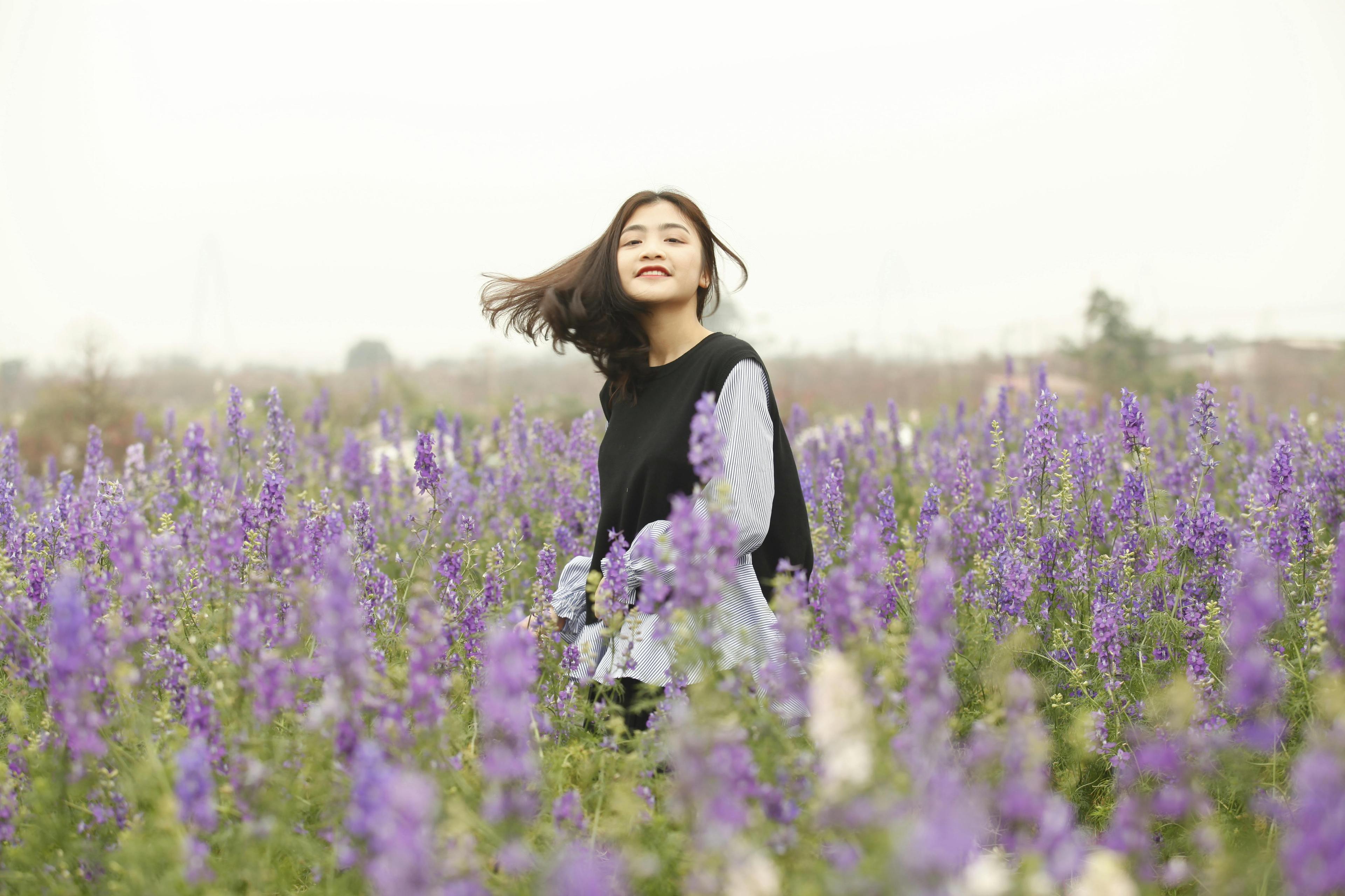 Woman With Black and White Long-sleeved Top on Garden